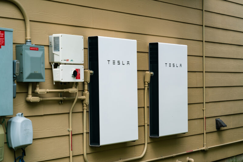 Two Tesla home battery units installed on a wall