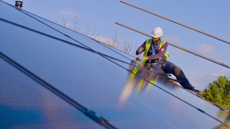 MCS certified installer installing solar panels on roof