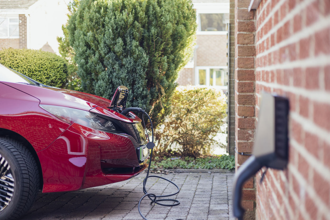 EV car charging outside a home in uk.