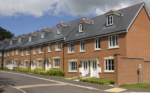 A row of terraced houses in England with no driveway.