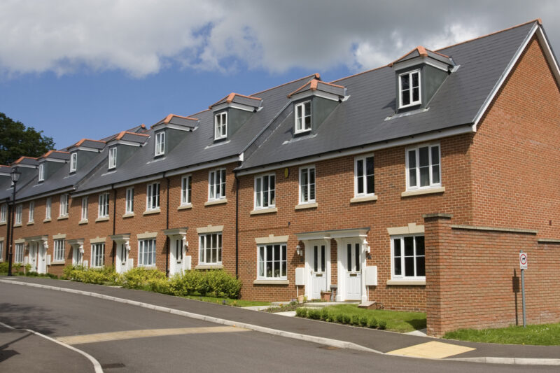 A row of terraced houses in England with no driveway.